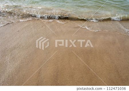 Gentle Waves Washing Ashore on Sandy Beach Gentle Waves Washing Ashore on Sandy Beach 112471036