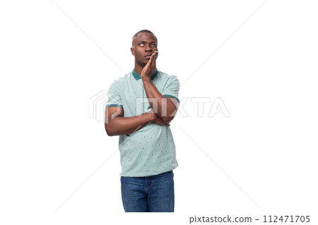 young handsome smiling african man dressed casually having doubts and thinking young handsome smiling african man dressed casually having doubts and thinking 112471705