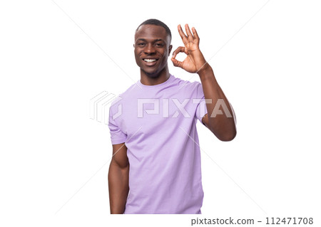 a young energetic American man dressed in a light lilac basic T-shirt is self-confident a young energetic American man dressed in a light lilac basic T-shirt is self-confident 112471708