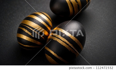Easter black with gold lines beautiful eggs on a black background. Minimal Easter concept. Happy Easter card Easter black with gold lines beautiful eggs on a black background. Minimal Easter concept. Happy Easter card 112472332
