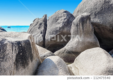 Huge rocks on the shore of the South China Sea in the World's End park. Sanya, China Huge rocks on the shore of the South China Sea in the World's End park. Sanya, China 112473540