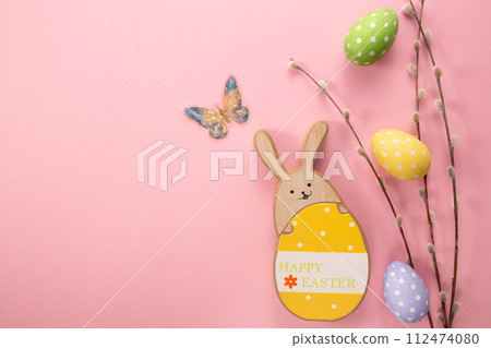 Easter eggs, wooden rabbit on yellow background. Greetings card, Happy Easters. Flat lay ,top view 112474080