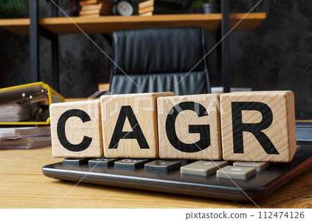 Cubes with abbreviation CAGR Compound annual growth rate on a calculator. Cubes with abbreviation CAGR Compound annual growth rate on a calculator. 112474126