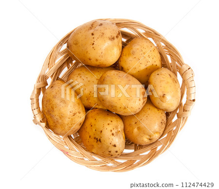 Potatoes in a wicker basket Potatoes in a wicker basket 112474429