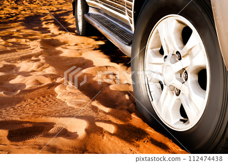 wheel of a car on the sand wheel of a car on the sand 112474438