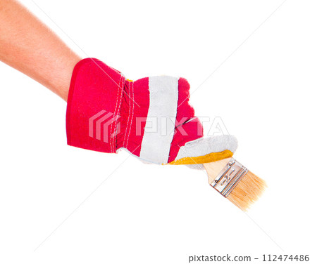 gloved hand with brush 112474486