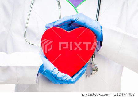 doctor holding red heart 112474498