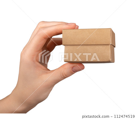 Hand holding small little mini gift box isolated on white background Hand holding small little mini gift box isolated on white background 112474519