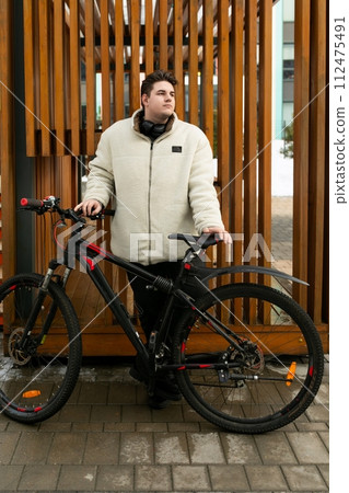 Lifestyle concept, young man riding a bicycle on the street 112475491