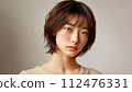 studio-shot portrait of young Asian woman with short haircut 112476331