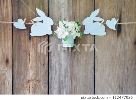 Spring came. Spring decor on wooden old boards background. Easter. Spring holiday background. Love. Spring came. Spring decor on wooden old boards background. Easter. Spring holiday background. Love. 112477026