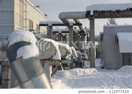 The main provides the city with hot water. Selective focus. The pipes of the central heating system 112477818