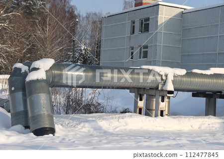 The main provides the city with hot water. Selective focus. The pipes of the central heating system 112477845