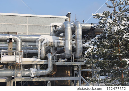 The main provides the city with hot water. Selective focus. The pipes of the central heating system 112477852
