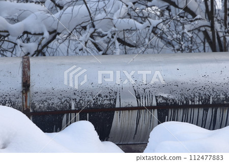 The main provides the city with hot water. Selective focus. The pipes of the central heating system The main provides the city with hot water. Selective focus. The pipes of the central heating system 112477883