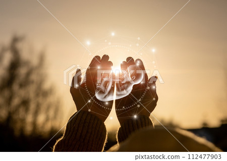 The show a human embryo against the background of the sun. The show a human embryo against the background of the sun. 112477903