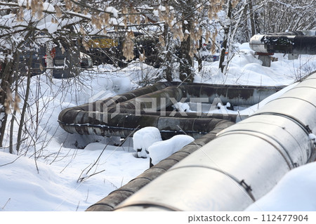 The main provides the city with hot water. Selective focus. The pipes of the central heating system The main provides the city with hot water. Selective focus. The pipes of the central heating system 112477904