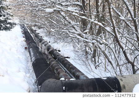 The main provides the city with hot water. Selective focus. The pipes of the central heating system The main provides the city with hot water. Selective focus. The pipes of the central heating system 112477912