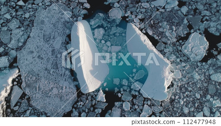 Aerial Antarctica glaciers floating blue ice ocean. Iceberg melting, environment ecology, climate change, global warming. Arctic winter landscape, nature background. Aerial Antarctica glaciers floating blue ice ocean. Iceberg melting, environment ecology, climate change, global warming. Arctic winter landscape, nature background. 112477948