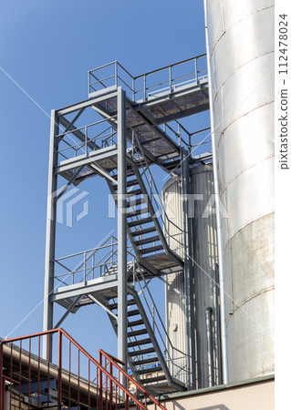 Brewery silos or tanks typically use for storing barley or fermented beer. Brewery silos or tanks typically use for storing barley or fermented beer. 112478024