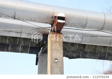 The main provides the city with hot water. Selective focus. The  pipes of the central heating system 112478104