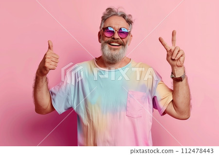 A man with a colorful shirt and sunglasses is giving a thumbs up and peace sign A man with a colorful shirt and sunglasses is giving a thumbs up and peace sign 112478443