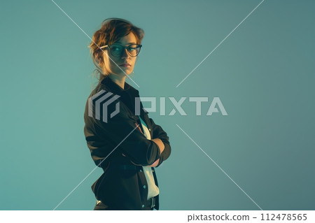 studio photo of a woman with glasses and dark case 112478565