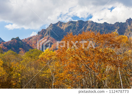 Nagano in autumn, Togakushi at the peak of autumn leaves, Togakushi mountain range Nagano in autumn, Togakushi at the peak of autumn leaves, Togakushi mountain range 112478773