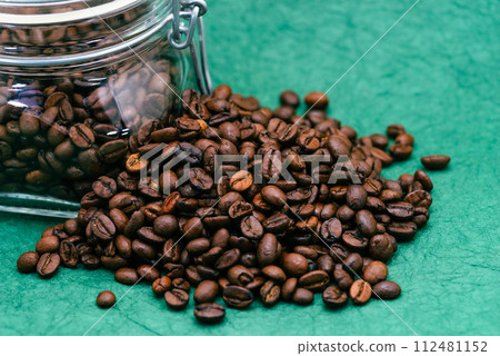 Coffee beans and glass bottle green background b-2-2 112481152
