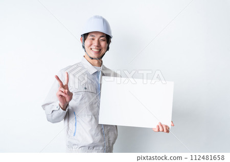 Men in work clothes/Message board 112481658