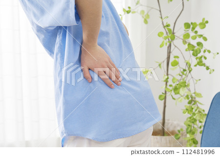 Young man with strained back, no face 112481996