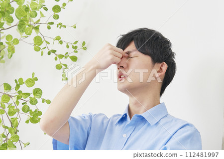 young man with tired eyes 112481997