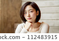 studio-shot portrait of young Asian woman with natural short haircut 112483915
