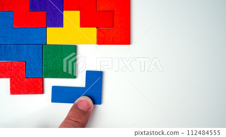Businessman trying to match pieces of jigsaw puzzle, Critical thinking, Decision making, Concentration concept, Logical thinking, situation analysis, Better way of problem solution search concept. Businessman trying to match pieces of jigsaw puzzle, Critical thinking, Decision making, Concentration concept, Logical thinking, situation analysis, Better way of problem solution search concept. 112484555