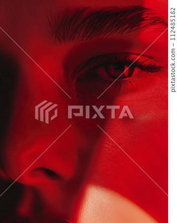 Dramatic portrait wrapped in red light 112485182
