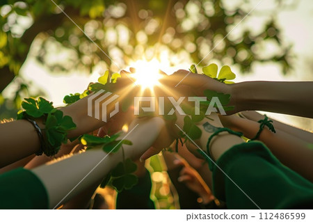 people circle hand united hold Green shamrock in St. Patrick 's Day . AI generated 112486599
