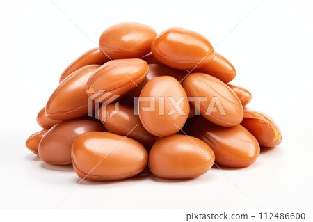Argan seeds isolated on a white banner background. Generative A 112486600