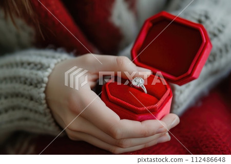diamond ring in red box in woman hand on . ai generative 112486648