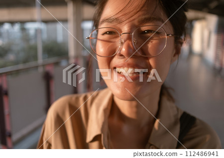 Woman making funny hilarious face to camera. 112486941