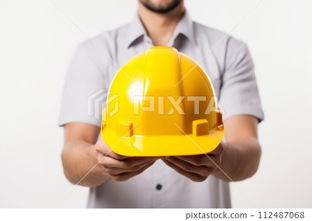 close up Man holding yellow helmet in white background. ai generative 112487068