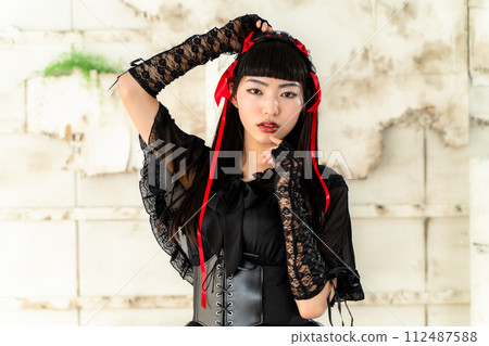 woman wearing gothic loli clothes woman wearing gothic loli clothes 112487588