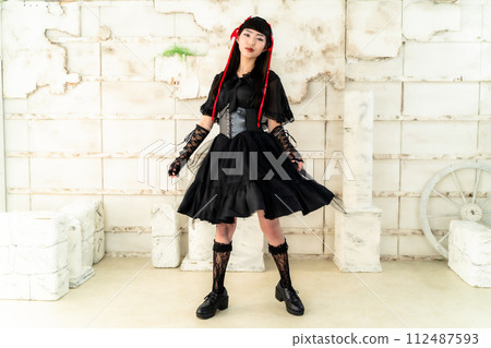 woman wearing gothic loli clothes woman wearing gothic loli clothes 112487593