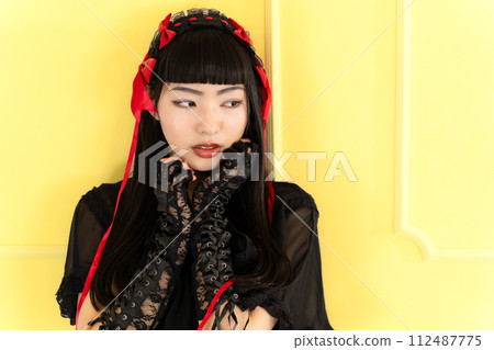 woman wearing gothic loli clothes woman wearing gothic loli clothes 112487775