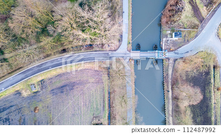 Aerial View of a Canal and Road Intersection 112487992