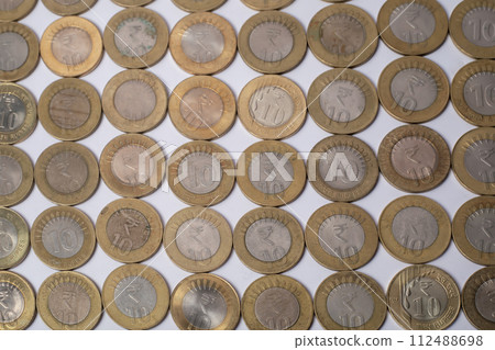 various Indian ten rupee coins texture background 112488698
