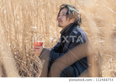 A man in his 30s doing outdoor activities A man in his 30s doing outdoor activities 112488753