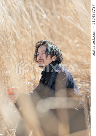 A man in his 30s doing outdoor activities A man in his 30s doing outdoor activities 112488757