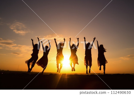 Peak triumph: silhouettes a top mountain, joyous group celebrates team success , embodying shared victories, harmonious collaboration, euphoria of collective achievement in nature's majestic embrace. 112490630