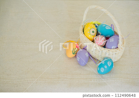 easter holiday concept with colorful egg and put in basket easter holiday concept with colorful egg and put in basket 112490648