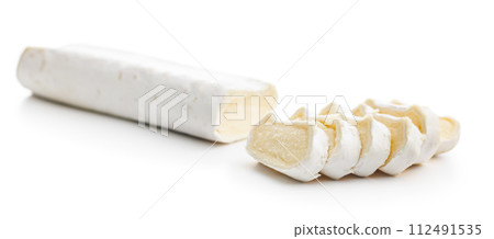 Sliced soft cheese on white background 112491535